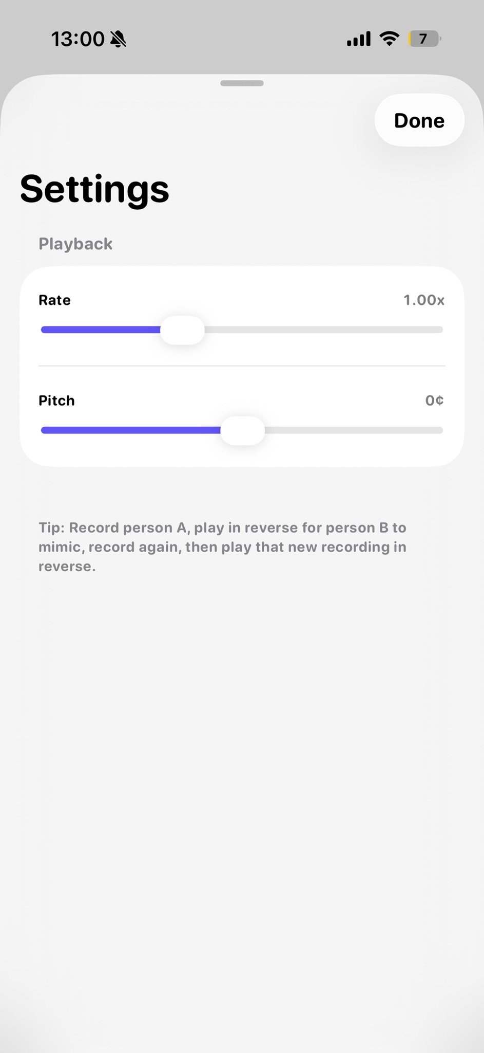 Phone screenshot of a Settings sheet with a Done button, a Playback section containing Rate (1.00x) and Pitch (0¢) sliders, and a tip about reverse-playing recordings.